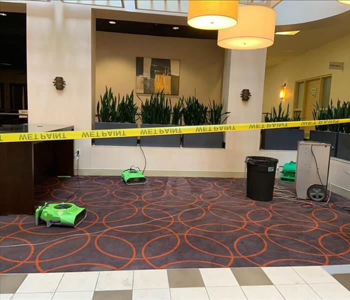 Drying equipment on floor of a commercial facility.