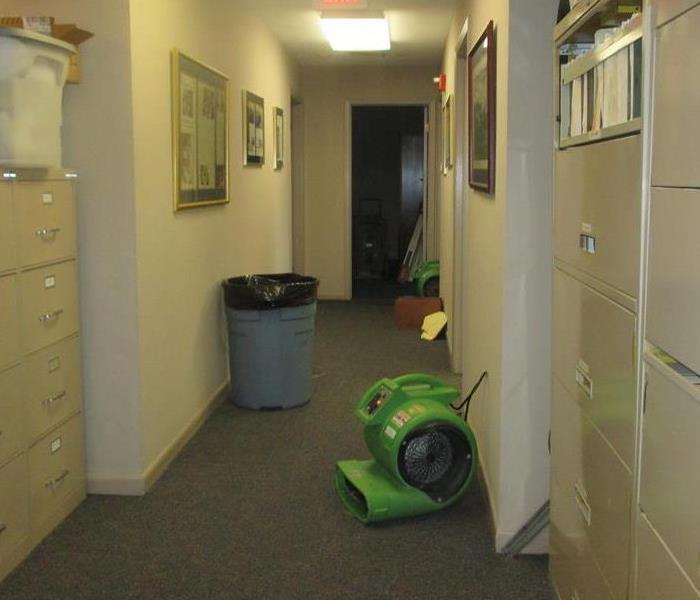 Air dryer on floor in hallway.