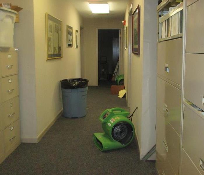 Drying equipment in office hallway.