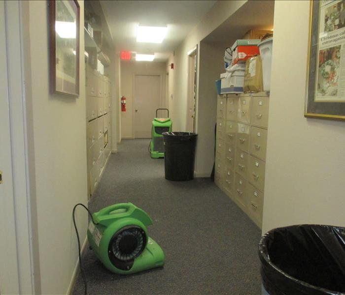 Air movers in hallway.