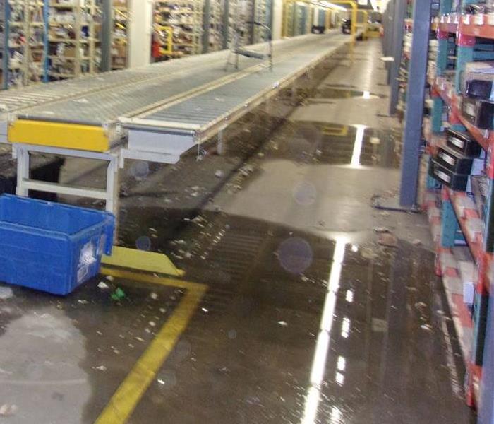 Water on warehouse floor.