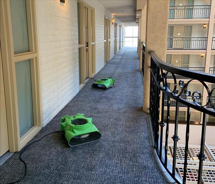 Drying equipment in hotel hallway.