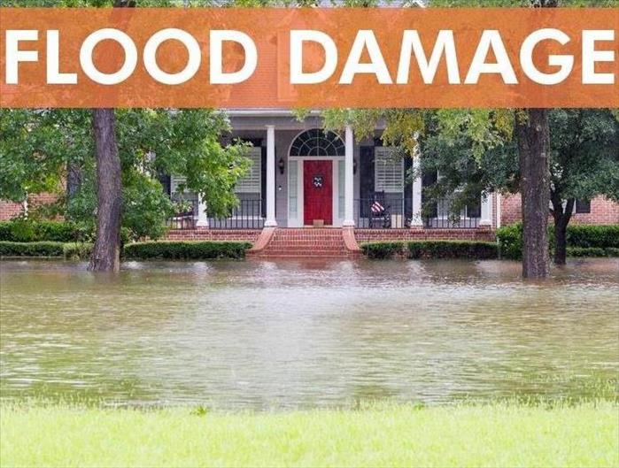 Home with flooding with the words "Flood Damage".